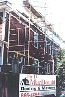 MacDonald roofing uses the Genesis Safety System extensively on the side of a two story building.